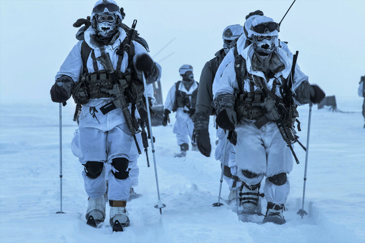 Lt. Col. Ethan Diven and Command Sgt. Maj. Evan Lewandowski lead a group of soldiers