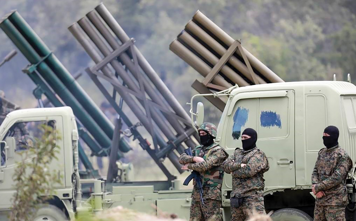 Fighters from the Lebanese militant group Hezbollah carry out a training exercise 21 May 2023 in Aaramta, a village in the Jezzine District of southern Lebanon.