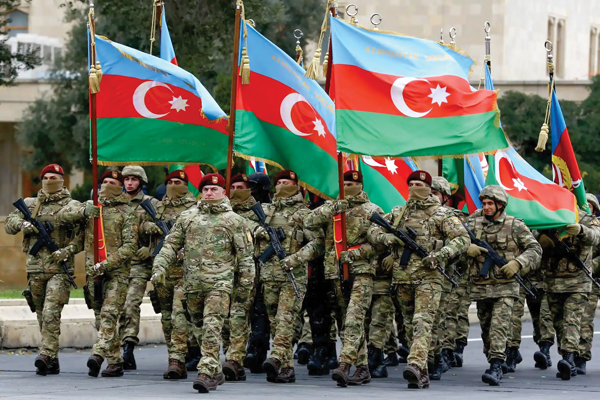 Azerbaijan soldiers march in a parade dedicated to Victory in the Patriotic War at the Azadliq Square in Baku, Azerbaijan, 10 December 2020