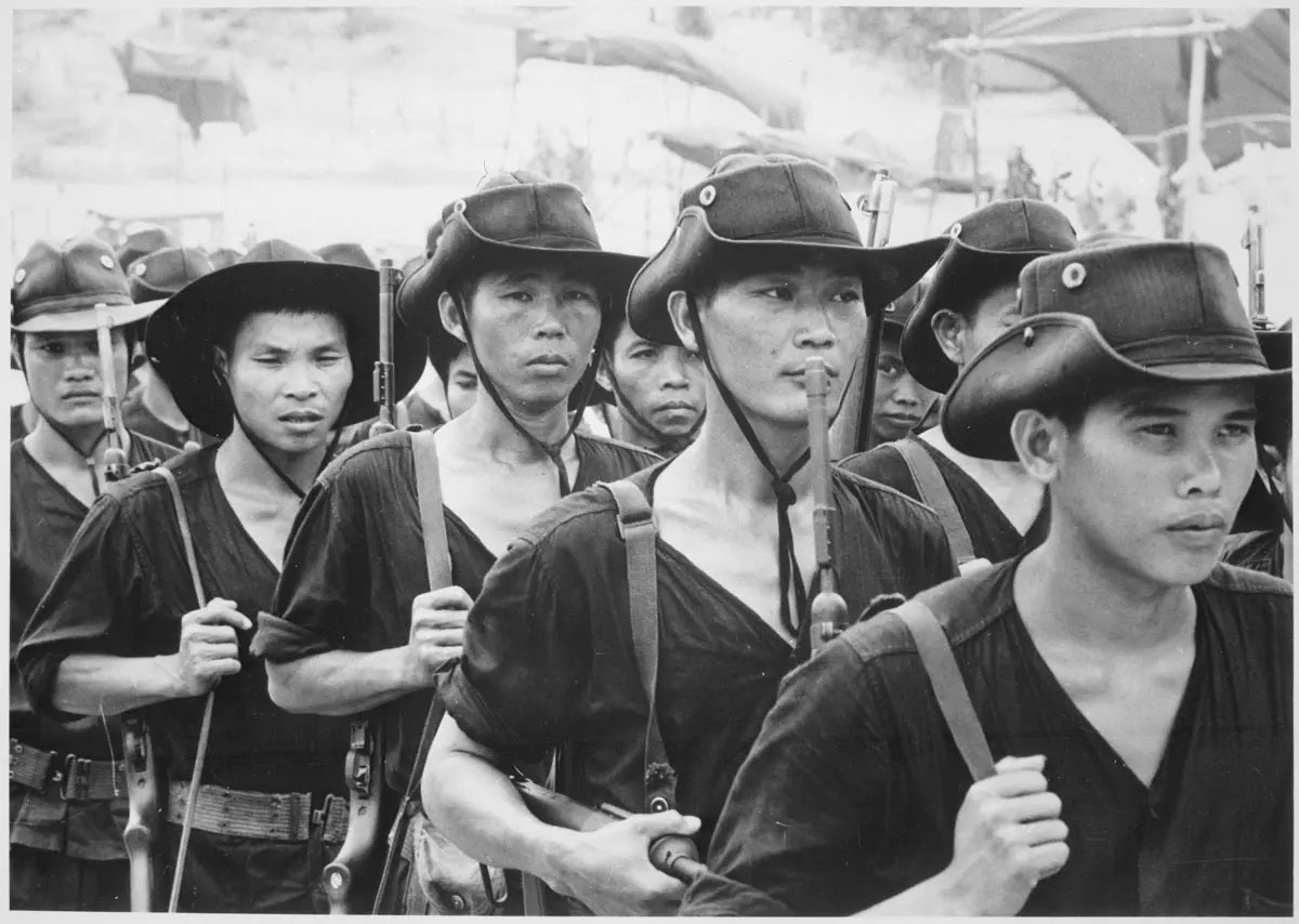 A group of South Vietnamese Regional Forces attend a training session on 31 December 1965