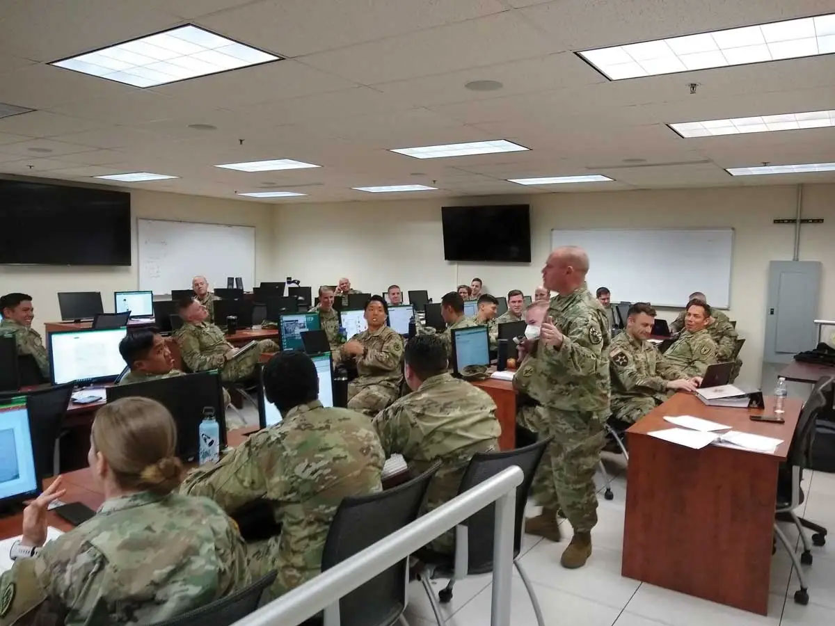 Capt. Christopher Marty reviews the intelligence preparation of the battlefield and intelligence collection processes with Reserve Component Captains Career Course students on 21 March 2022 at the U.S. Army Intelligence Center, Fort Huachuca, Arizona.
