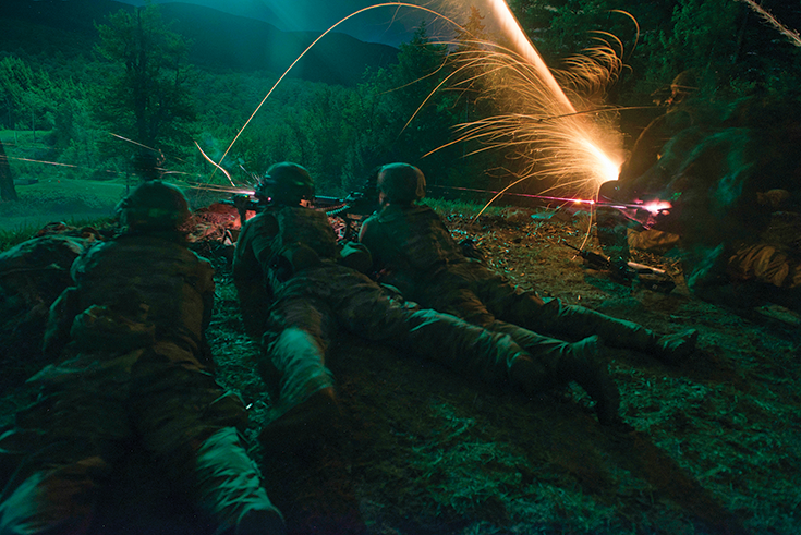Soldiers with Company B, 3rd Battalion, 172nd Infantry Regiment, 86th Infantry Brigade Combat Team (Mountain), Maine Army National
Guard, establish a support-by-fire position 20 July 2020 during a nighttime live-fire training lane