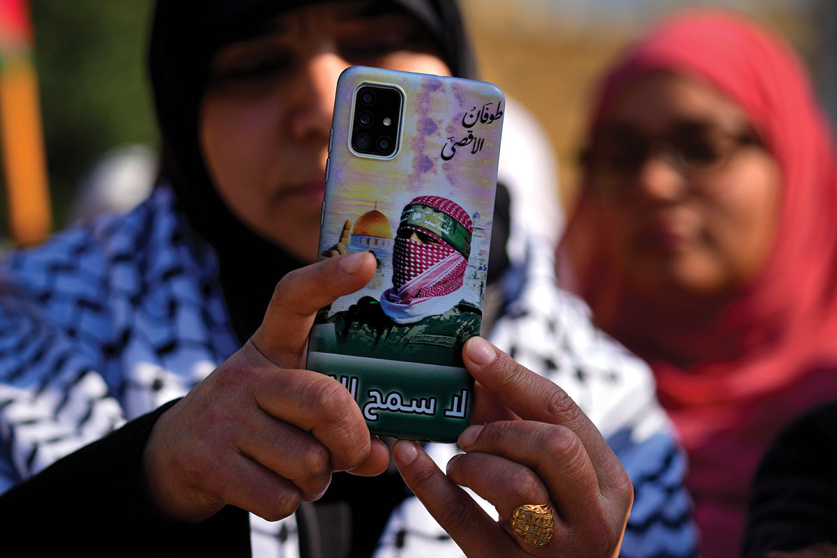 A demonstrator takes photos