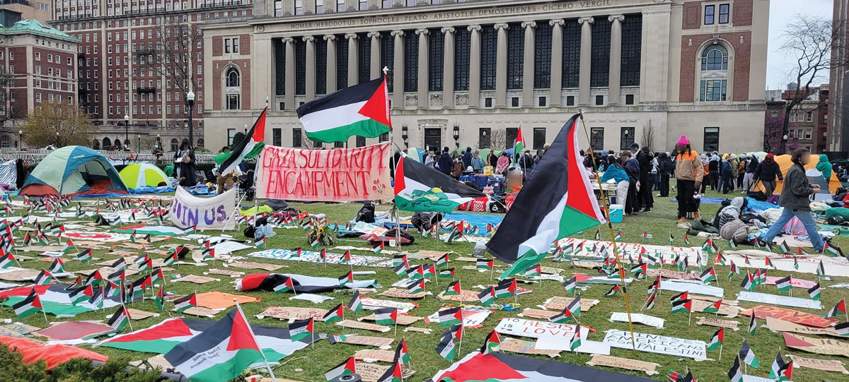Pro-Palestinian signs and flags are laid out at the second campus encampment