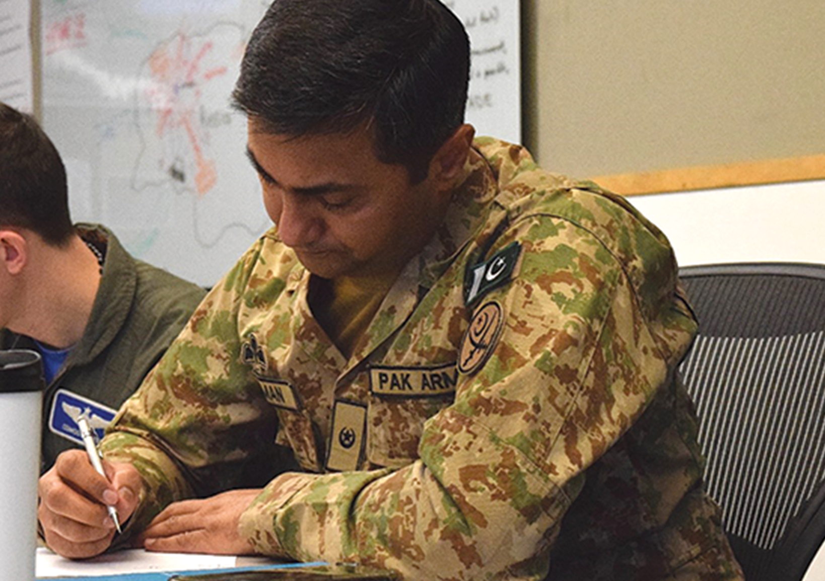 Pakistani Maj. Usman Mahmood develops an individual haiku poem and supporting visual aid.