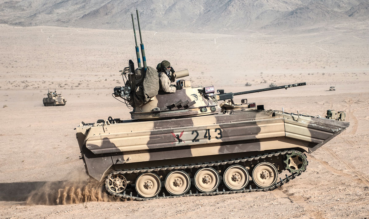 An opposing force surrogate vehicle from Hawg Troop, 2nd Squadron, 11th Armored Cavalry Regiment, maneuvers through the desert during National Training Center rotation 17-01, at Fort Irwin, California, 7 October 2016