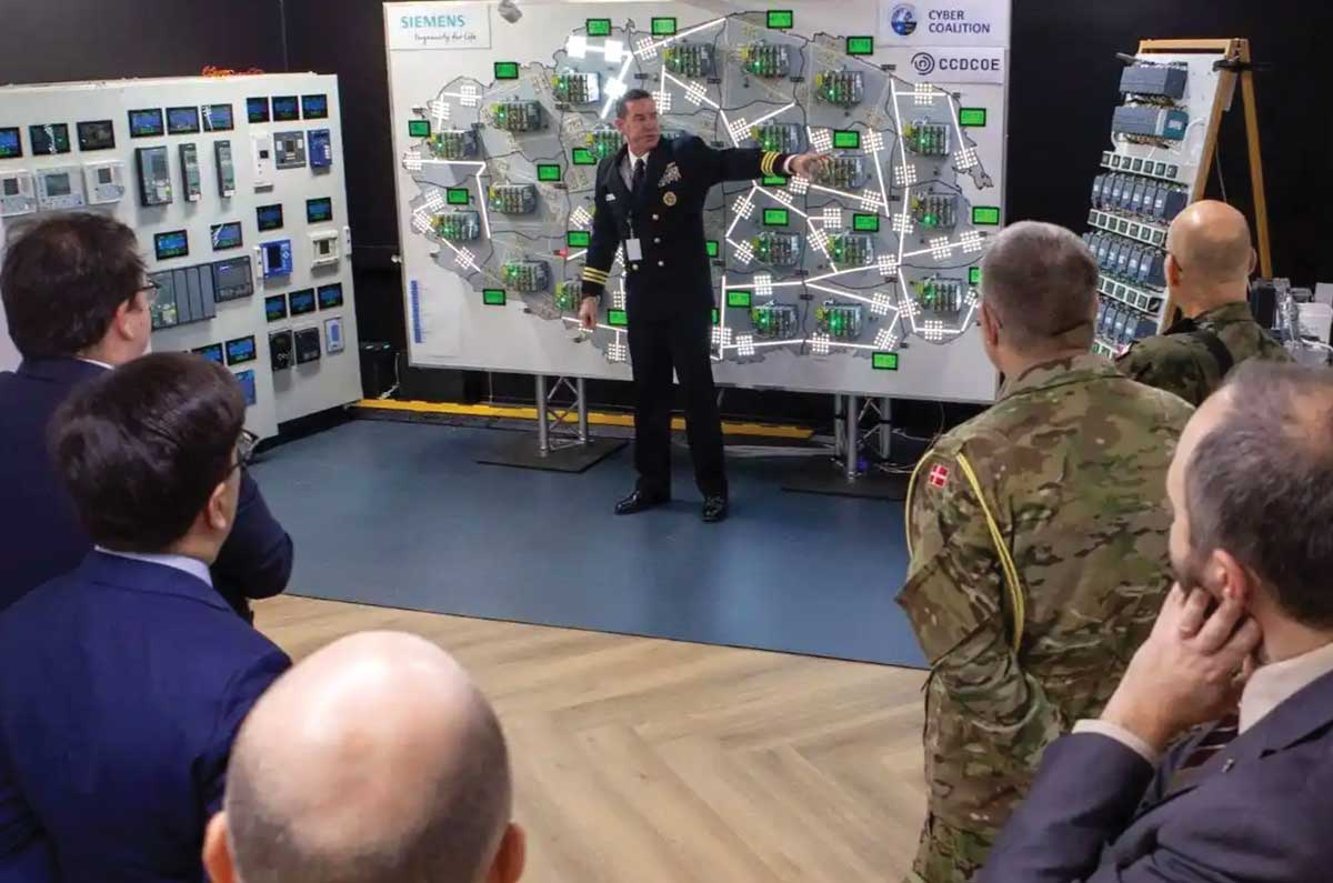 U.S. Navy Cmdr. Charles Elliott, Cyber Coalition 2022 exercise director, briefs participants during Cyber Coalition 2022 in Tallinn, Estonia