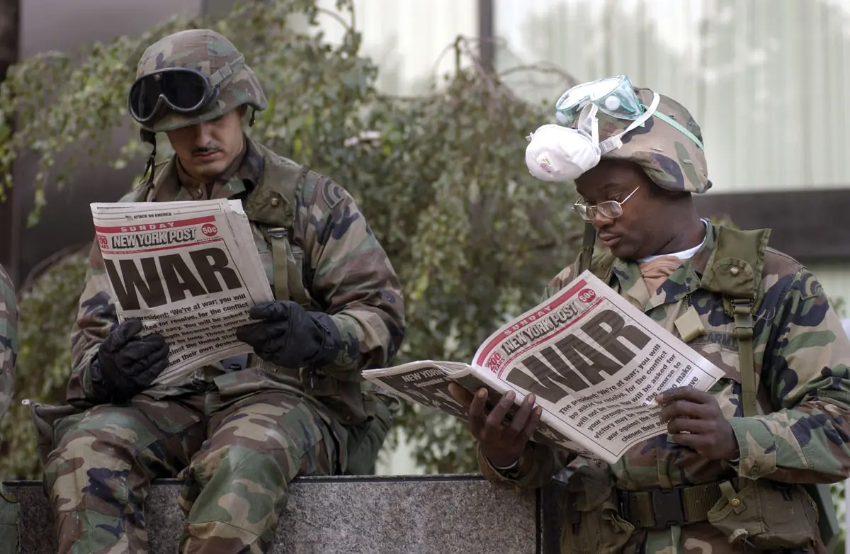 U.S. soldiers reading the New York Post
