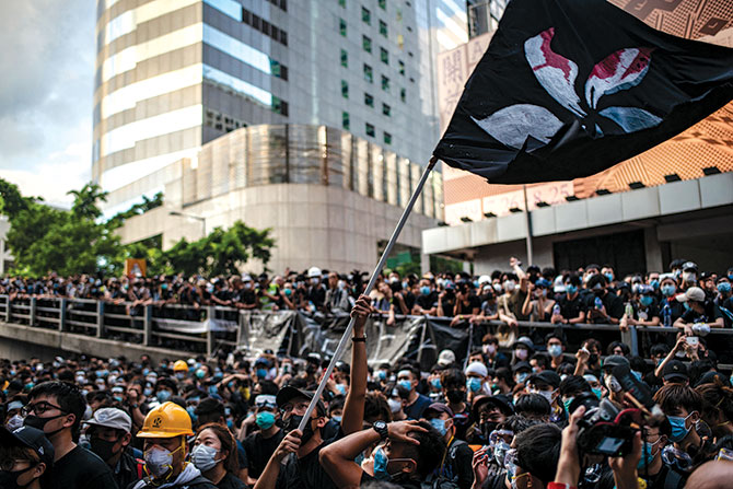 A protester holds up the Hong Kong flag