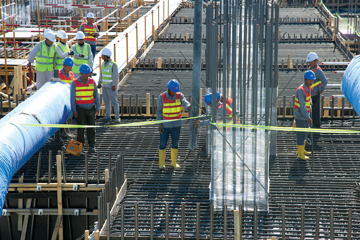 Employees work on a construction site