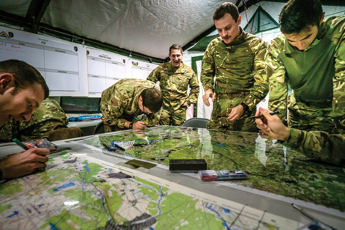 Soldiers working around a few maps