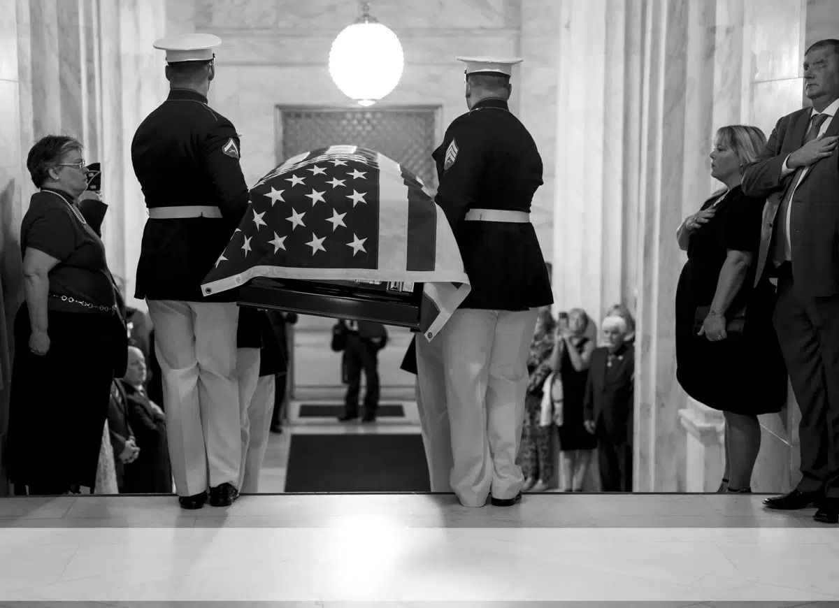 U.S. Marine Corps body bearers from Marine Barracks Washington, D.C., carry the casket of Chief Warrant Officer 4 Hershel “Woody” Williams at the West Virginia State Capitol rotunda during memorial services 3 July 2022 in Charleston, West Virginia