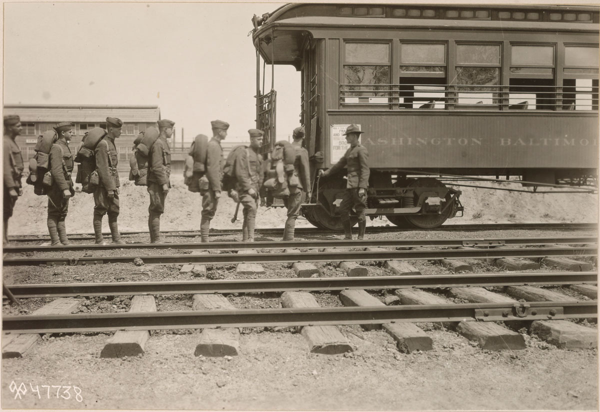 Replacement troops board a train