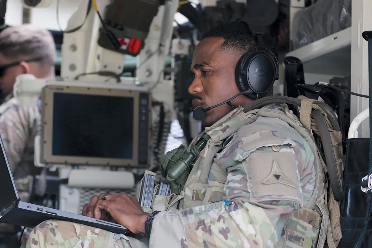 Staff Sgt. Steve Mathiew, a signal support system NCO with III Armored Corps, operates the Mounted Assured, Positioning, Navigation, and Timing System (MAPS)