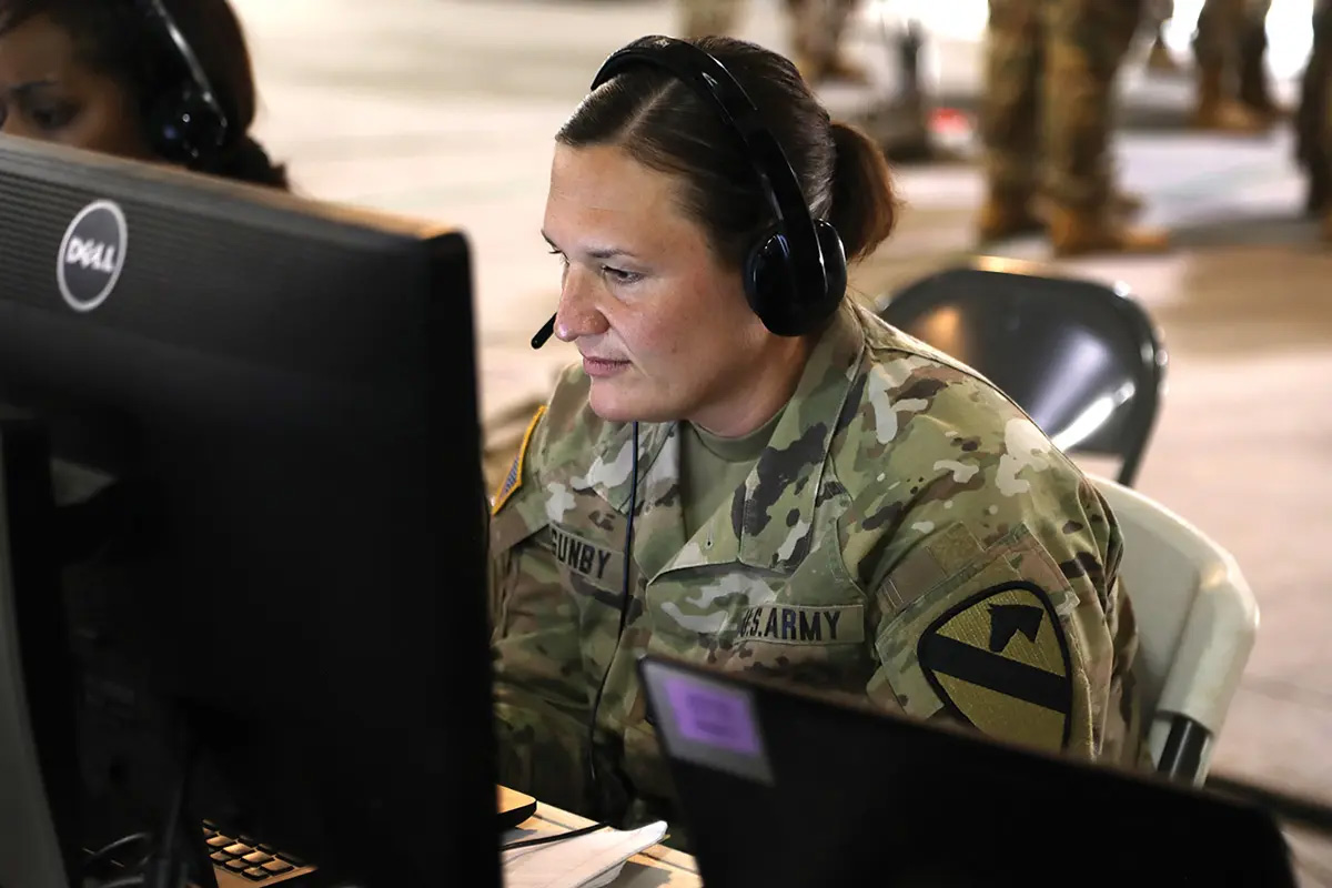 Master Sgt. Laura Gunby, 1st Cavalry Division (1CD) medical operations noncommissioned officer, tracks and coordinates medical support on 12 April 2023 during Warfighter Exercise 23-04