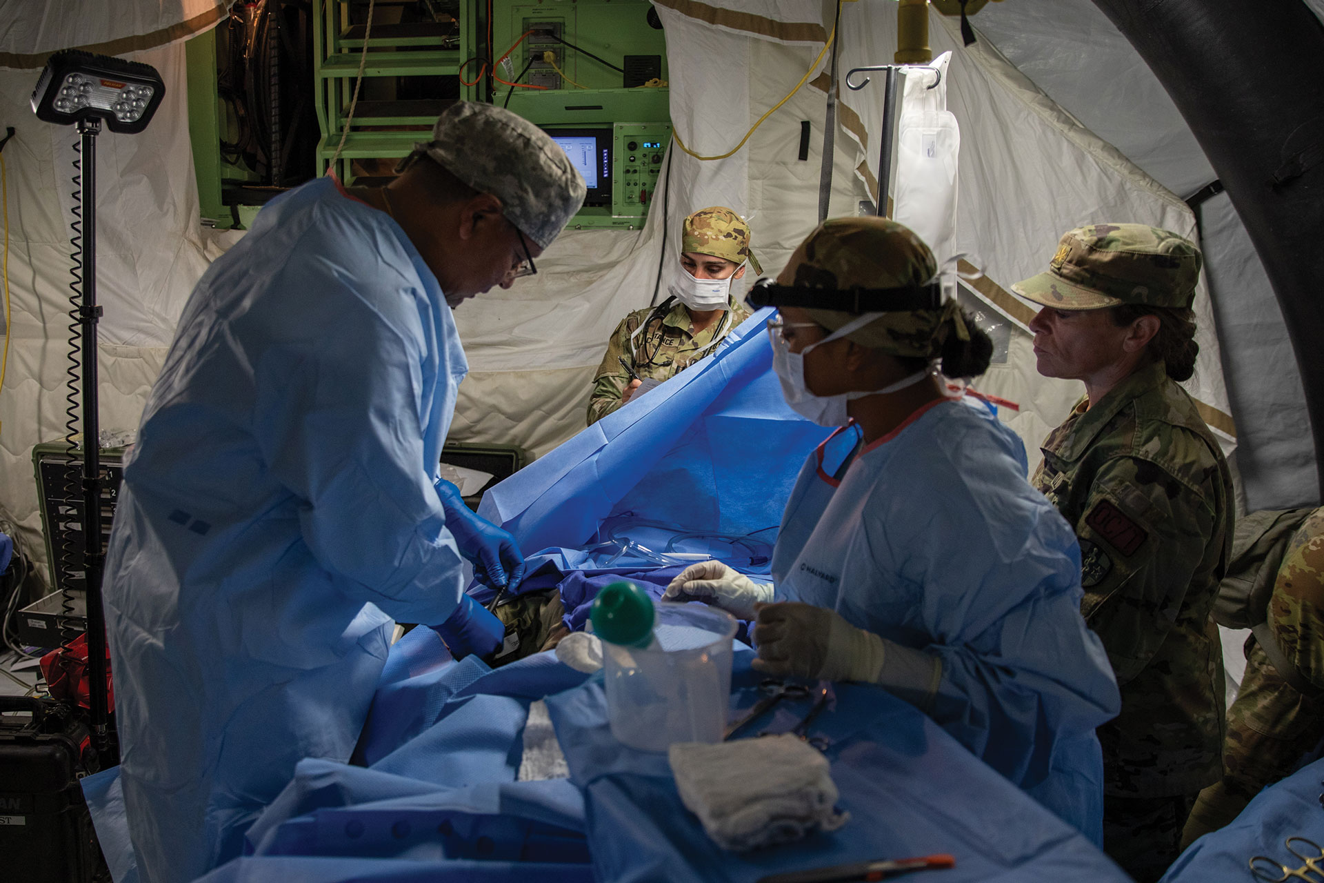 Army Reserve soldiers assigned to the 628th Forward Resuscitative Surgical Detachment provide emergency care for notional casualties during Exercise Global Medic on 7 June 2025 at Fort Hunter Liggett, California. 
