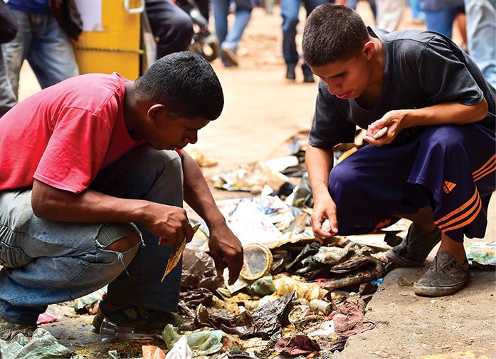 People look for food in garbage