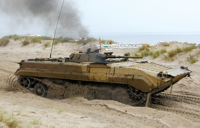A Polish BMP-1 infantry fighting vehicle maneuvers at the Central Air Force Training Range 16 June 2016 on the shore of the Baltic Sea in Poland. (Photo courtesy of Wikimedia Commons)