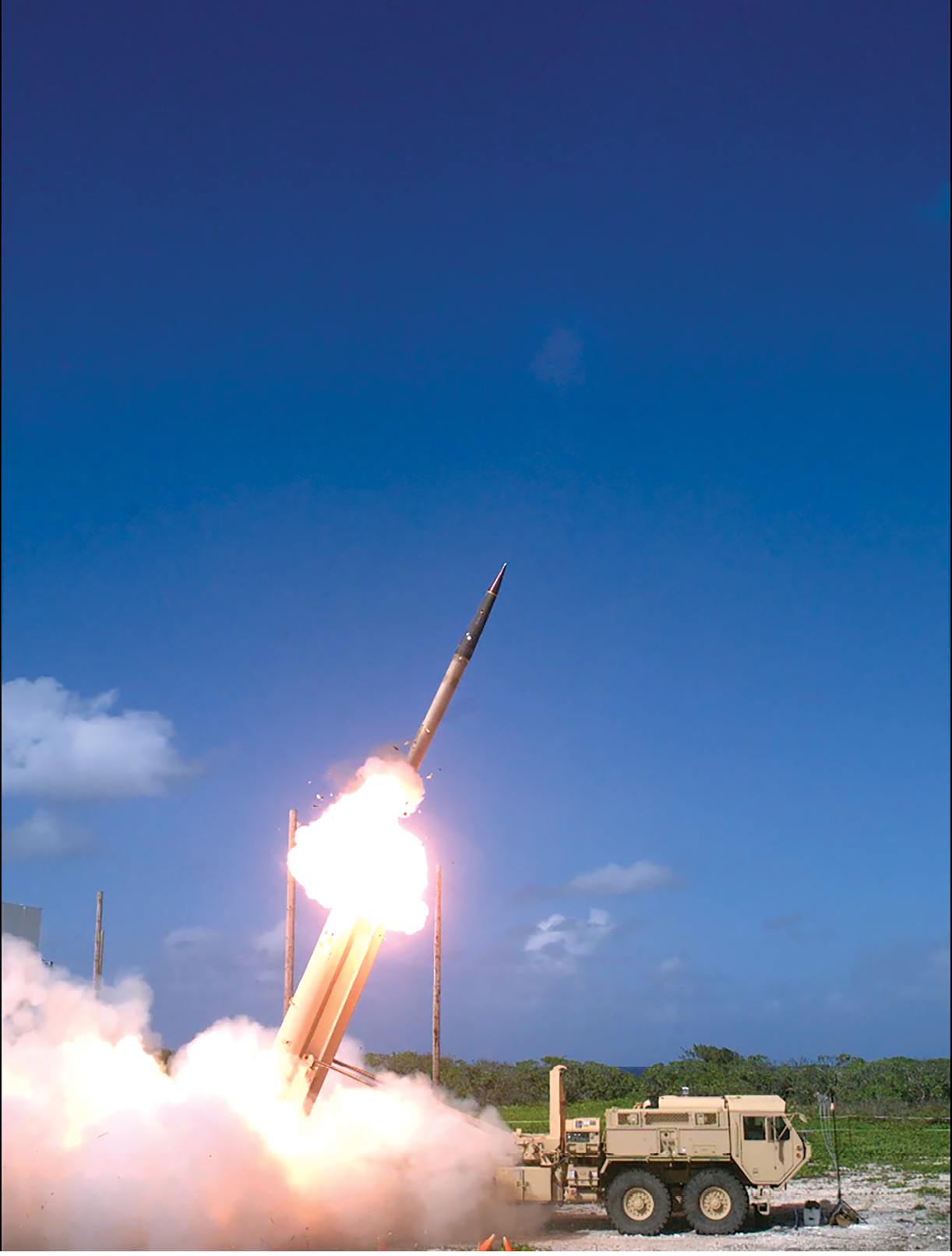 A Terminal High Altitude Area Defense (THAAD) interceptor missile is launched during a flight test 1 November 2015 from a THAAD battery located on Wake Island, which lies northeast of Micronesia in the Pacific Ocean. During the test, the THAAD system successfully intercepted two air-launched ballistic missile targets. (Photo by Ben Listerman, U.S. Missile Defense Agency)