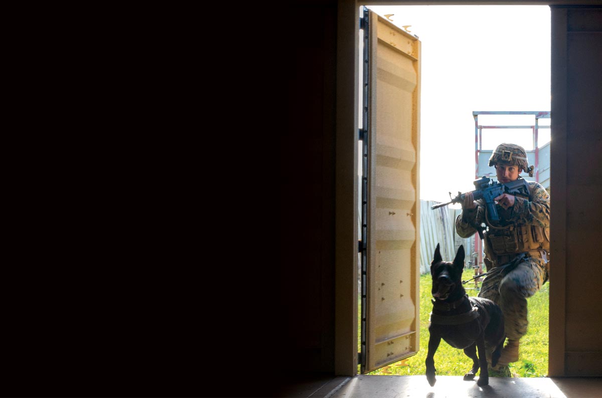 Sgt. Chase McConnell, 3rd Law Enforcement Battalion, and Deuce the dog