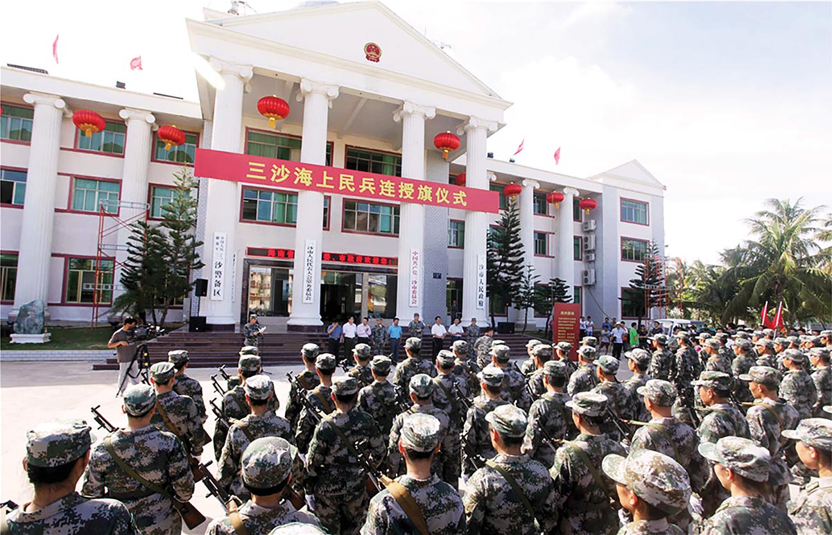 Soldiers attend a flag conferral ceremony 21 July 2013 during the official launch of Sansha City’s maritime militia. (Photo courtesy of China Foto Press)