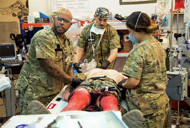 Sailors from the Navy Expeditionary Medical Unit care for a simulated casualty