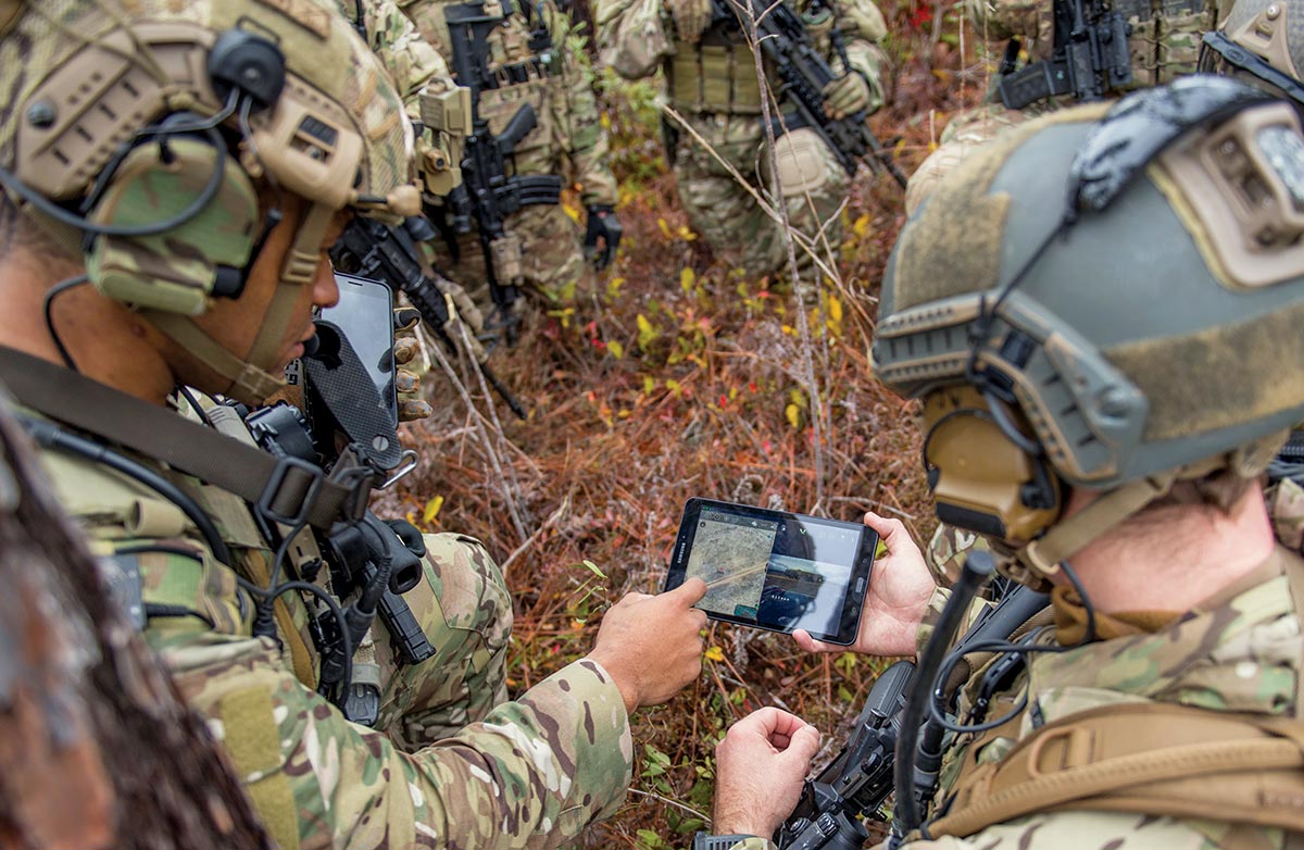 Members of the 6th Special Operations Squadron use a tablet to upload coordinates 17 December 2019 during an exercise showcasing the capabilities of the advanced battle management system (ABMS) at Duke Field, Florida.