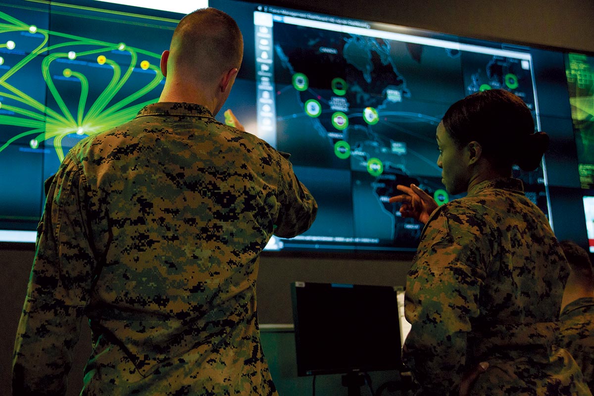 Marines with Marine Corps Forces Cyberspace Command observe computer screens 5 February 2020 at Lasswell Hall in the cyber operations center at Fort George G. Meade, Maryland. (Photo by Staff Sgt. Jacob Osborne, U.S. Marine Corps)