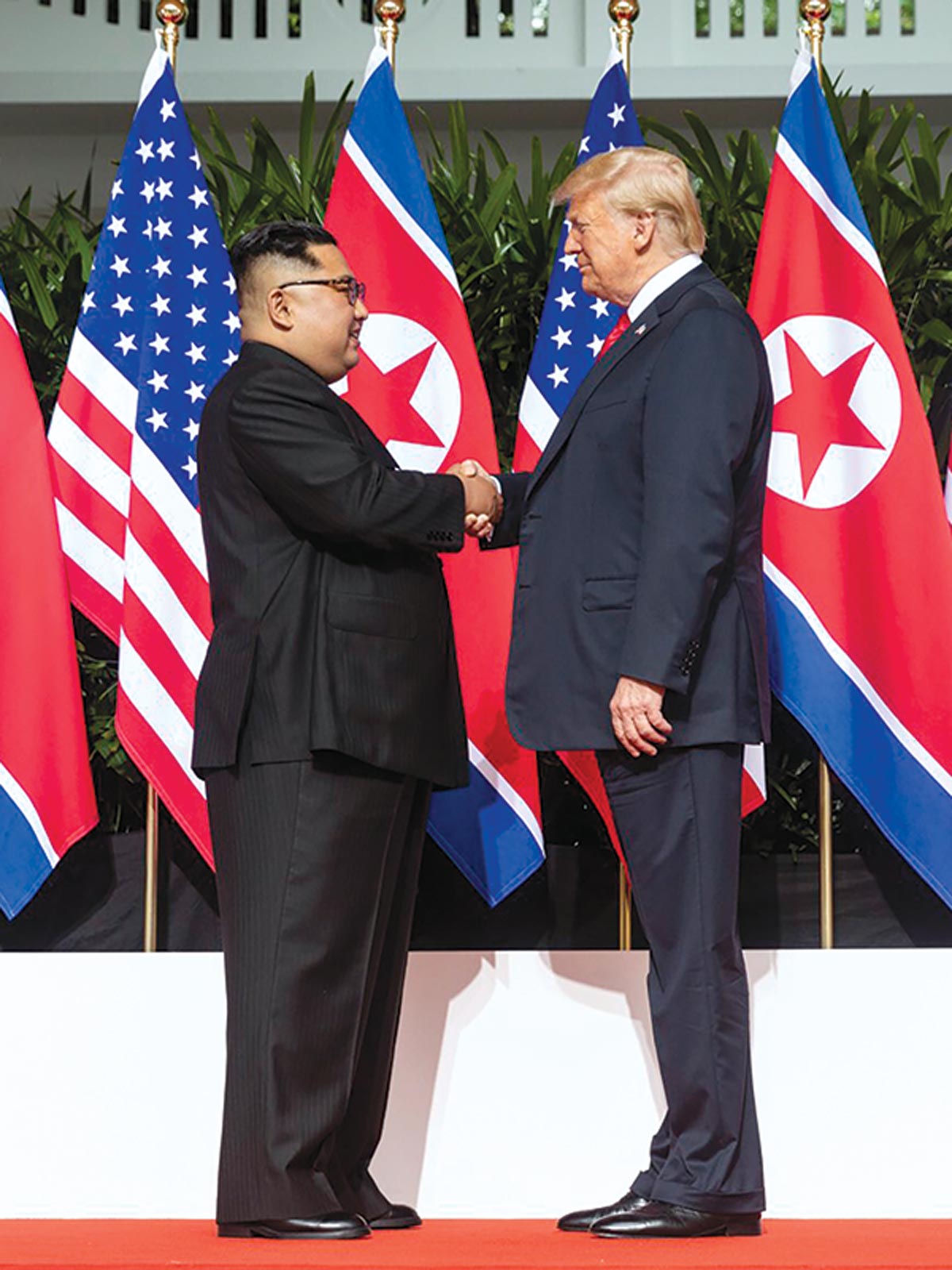 North Korean leader Kim Jong-un shakes hands with President Donald J. Trump after taking part in a signing ceremony 12 June 2018 at the end of their historic U.S.-North Korea summit at the Capella Hotel on Sentosa Island, Singapore. Photo by Shealah Craighead, Official White House