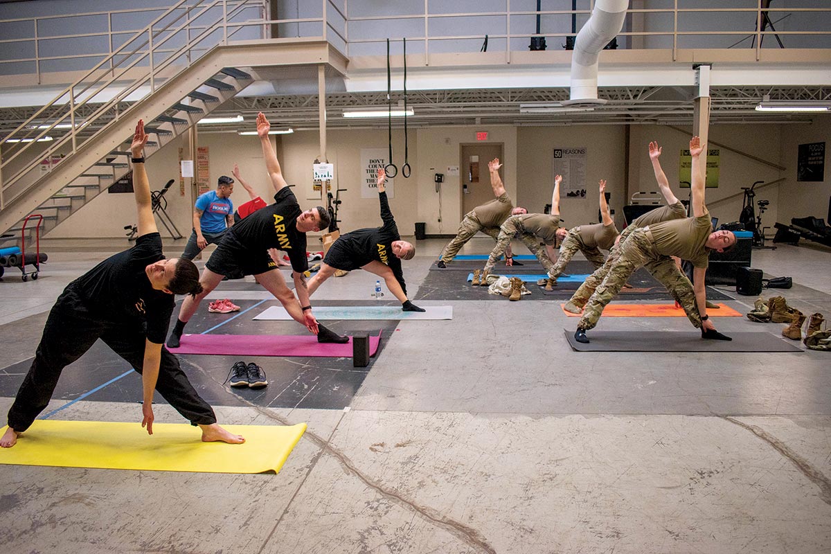 Thunderbolt soldiers use their lunchtime to take advantage of a holistic health and fitness combat-mobility yoga session 26 February 2020 at the 5th Battalion, 3rd Field Artillery headquarters at Joint Base Lewis-McChord, Washington.