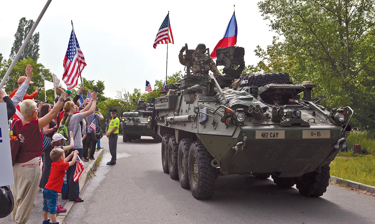 Completing the first leg of their tactical road march from Rose Barracks, Germany, to Tapa Military Training Area, Estonia, soldiers of the 2nd Cavalry Regiment drive their Strykers into Ruzyne, Czech Republic, 27 May 2016 during Operation Dragoon Ride.