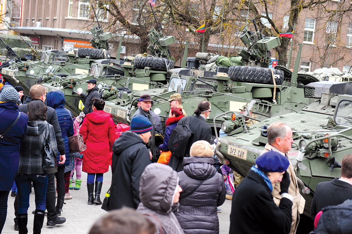 On 23 March 2015, day three of Operation Dragoon Ride, soldiers from Iron Troop, 3rd Squadron, 2nd Cavalry Regiment, visit the town of Panevezys, Lithuania. A large crowd of onlookers came out to interact with the soldiers and take pictures of themselves with the U.S. Stryker armored vehicles.