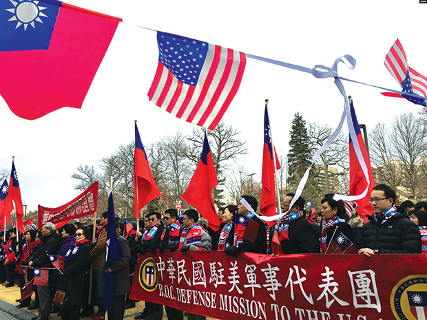 At a New Year’s Day flag-raising ceremony held 2 January 2016 in Washington, D.C., Taiwan representative Shen Luxun speaks to a crowd supportive of Taiwan’s independence, emphasizing the importance of Taiwan’s flag as a national emblem of the Republic of China. (Photo by Zhong Chenfang, Voice of America)
