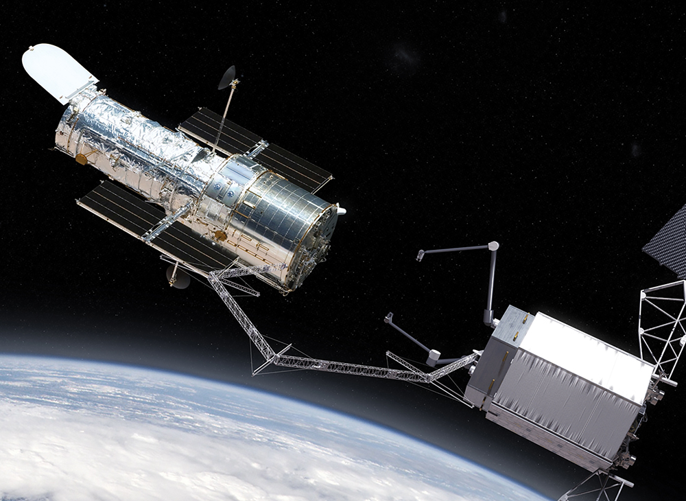 Um satélite norte-americano utiliza um braço robótico para capturar o Telescópio Espacial Hubble, a fim de efetuar reparos no espaço, 02 Jul 14. Uma firma comercial de rastreamento de satélites detectou um satélite SHIYAN chinês com um braço robótico semelhante praticando manobras para prender e soltar outros satélites. A China poderia usar essa capacidade para fins militares contra satélites dos EUA e de nações amigas no caso de um início de hostilidades. (Foto cedida pela NASA)