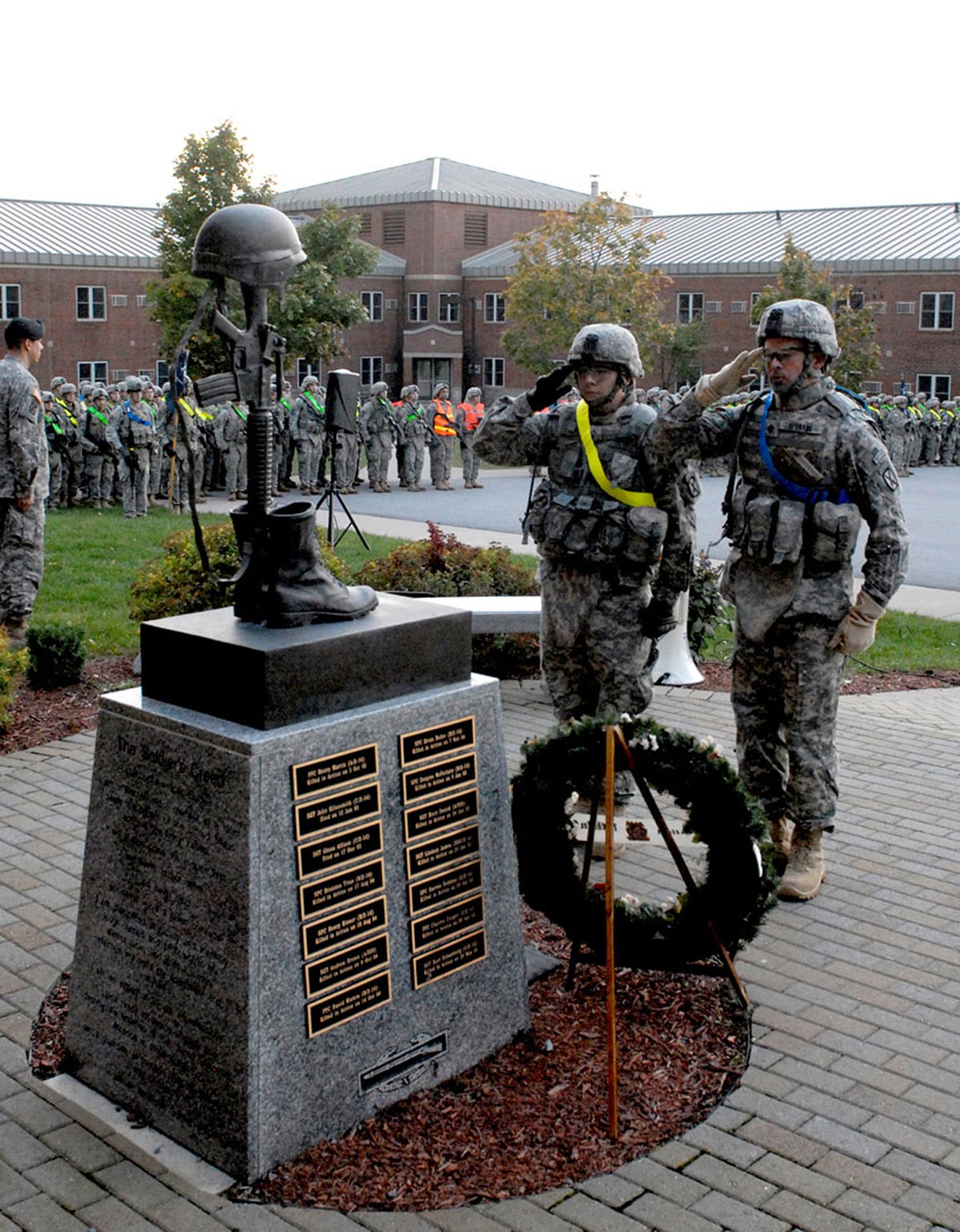 salute the Memorial of the Fallen Golden Dragons during the Mogadishu Mile Run on Oct. 4, 2010