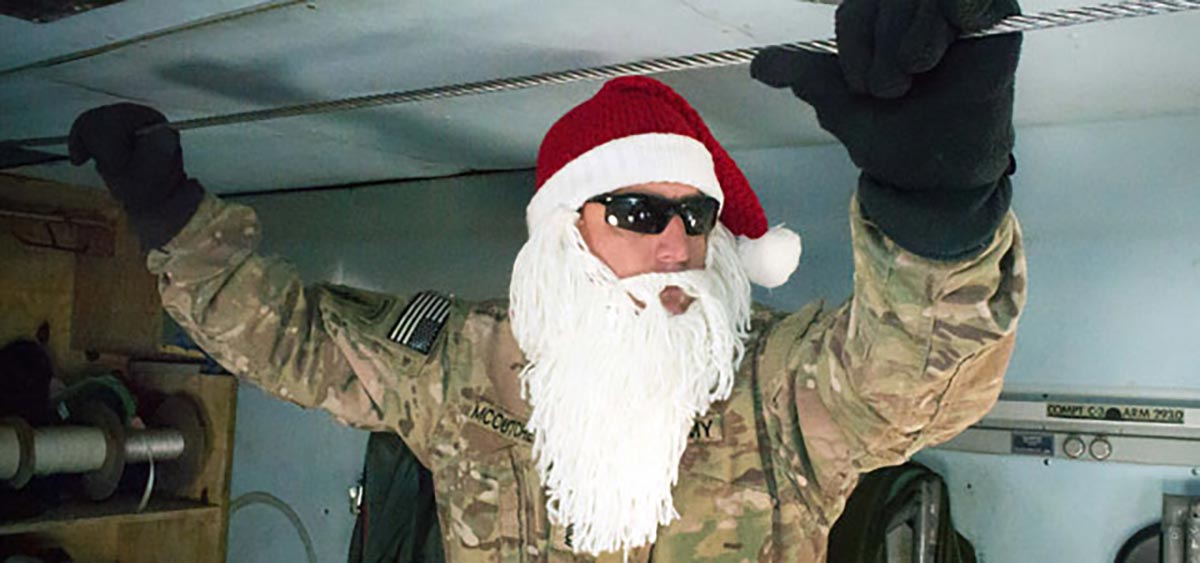 A U.S. soldier prepares to deliver air bundles containing care packages