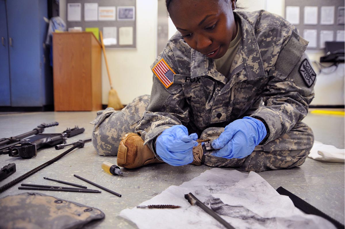 A student works recovery on her weapon during a Warrior Leader Course lesson taught by Sgt. 1st Class Anna Shurley, small group leader, in April at NCO Academy Hawaii, Schofield Barracks.