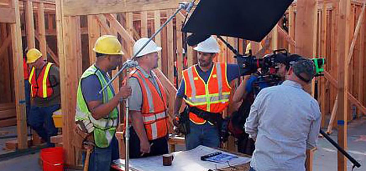 Retired Wisconsin Army National Guard Staff Sgt. Brian Jopek, <em>left</em>, carries a toolbox on the set of a public service announcement about Gold Star families June 3 in Los Angeles. Jopek was one of several Gold Star family members to take part in the public service announcements under the auspices of the Army’s Survivor Outreach Services.