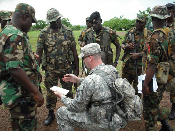 Sgt. 1st Class Grady Hyatt, with U.S. Army Africa, leads an after-action review with soldiers of the Ghana Army. Hyatt was in Africa as part of the Army’s “regionally aligned forces” concept, meant to pair Army units with combatant commanders worldwide. (U.S. Army Africa Public Affairs)