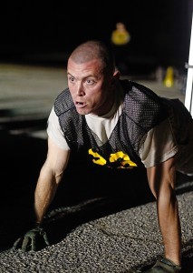 Sgt. 1st Class David Smith, U.S. Army Training and Doctrine Command’s NCO of the Year, performs pushups during the Army Physical Fitness Test event early Tuesday morning at the 2014 U.S. Army Best Warrior Competition at Fort Lee, Va. (Photo by Sgt. Jourdain Yardan)
