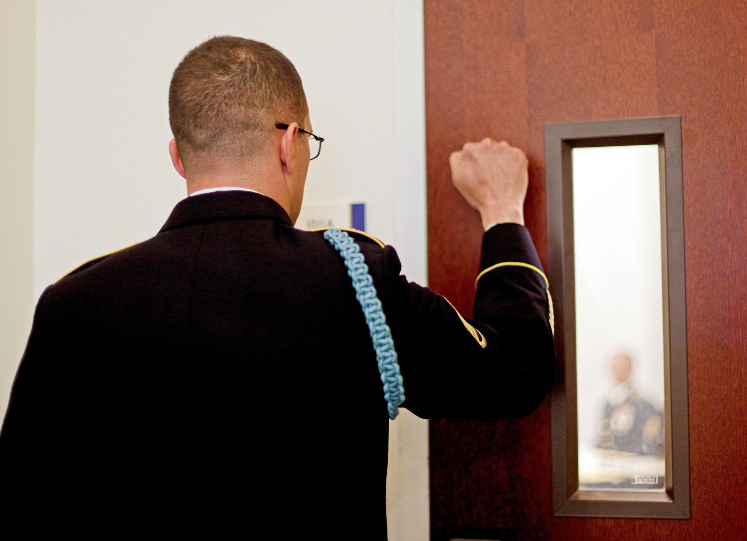 Staff Sgt. Jesse K. Murray, the U.S. Army Africa NCO of the Year, knocks to enter the board Wednesday at the 2014 Best Warrior Competition at Fort Lee, Va (Photo by Staff Sgt. Patricia Ramirez)