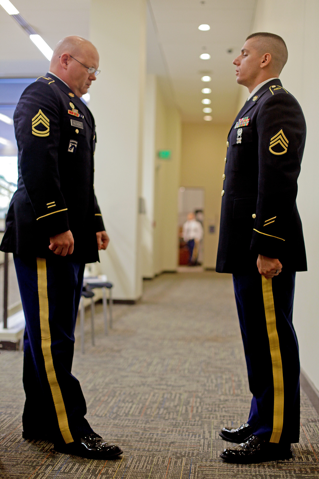 Staff Sgt. Luke R. Klein (right), the Army Service Component Commands’ NCO of the Year, is inspected by his sponsor just before entering the board Wednesday at the 2014 Best Warrior Competition at Fort Lee. (Photo by Staff Sgt. Patricia Ramirez)