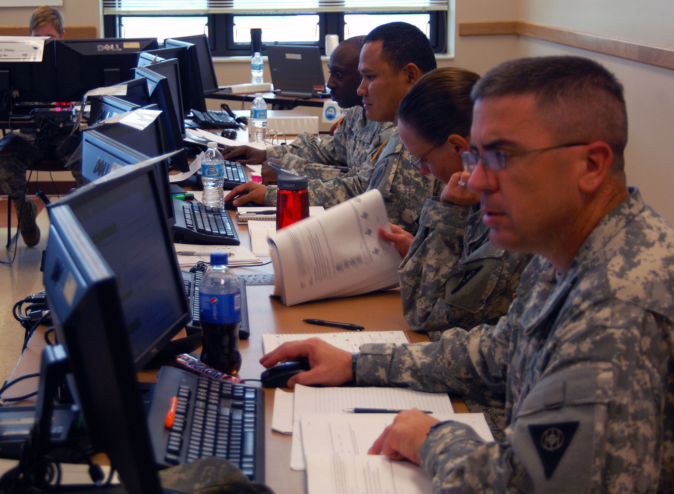 Students in the Battle Staff Course at the Staff Sgt. Todd R. Cornell NCO Academy in Fort McCoy, Wis., work on a practical exercise related to the Command Post of the Future (CPOF). (Photos by Jonathan (Jay) Koester)