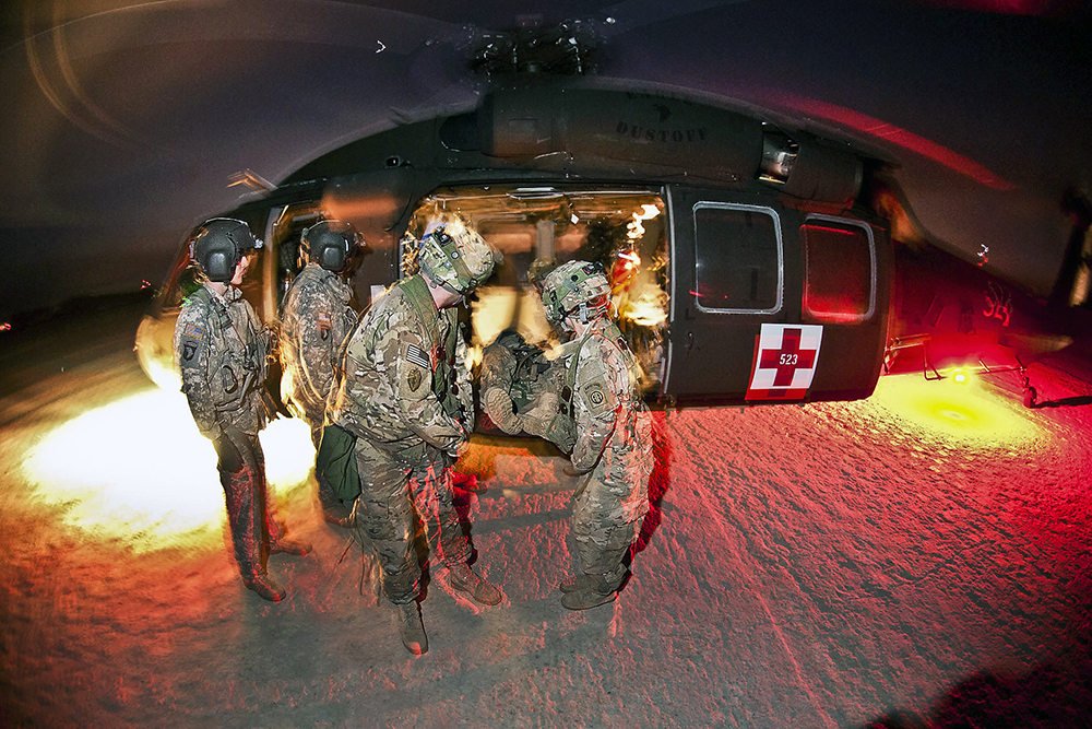 Medics with 82nd Airborne Divisions 1st Brigade Combat Team retrieve notionally wounded paratroopers.