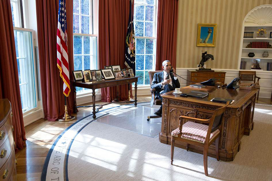 President Barack Obama talks on the phone in the Oval Office on Feb. 5. The mission of the White House Communications Agency is to provide the president with the same ability to communicate as in the Oval Office no matter where he travels. (White House photo by Pete Souza)