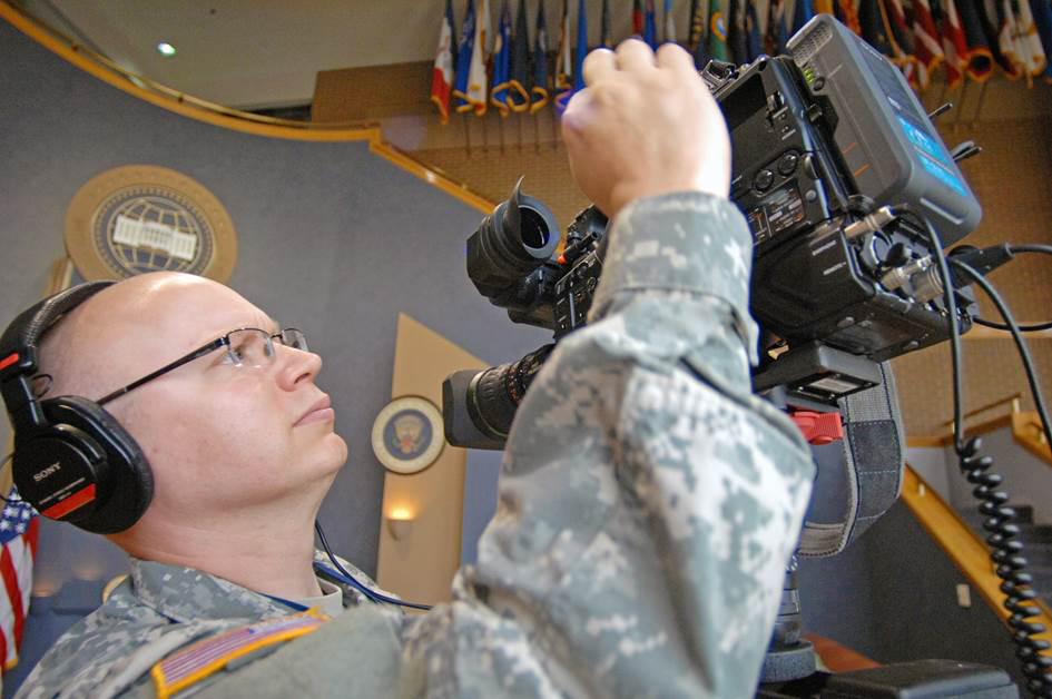 A WHCA NCO checks a camera during a White House-sponsored event. (Photo courtesy of WHCA)