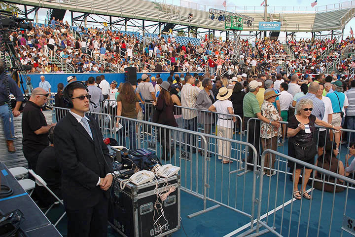 A WHCA NCO monitors communication equipment during a presidential event. WHCA personnel wear business attire as their uniform when traveling. (Photo courtesy of WHCA)