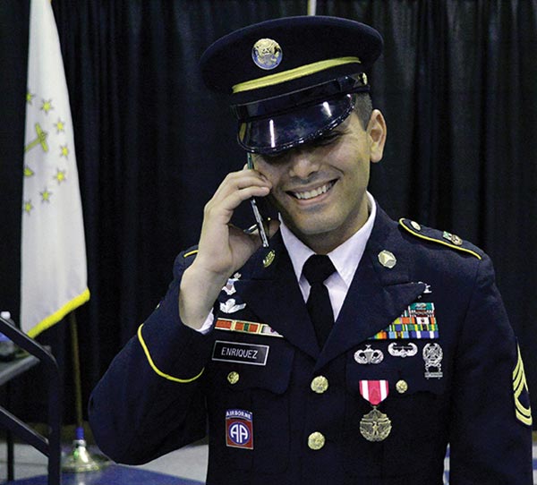 Sgt. 1st Class Samuel Enriquez calls his wife after being declared the 2015 AIT Platoon Sergeant of the Year.