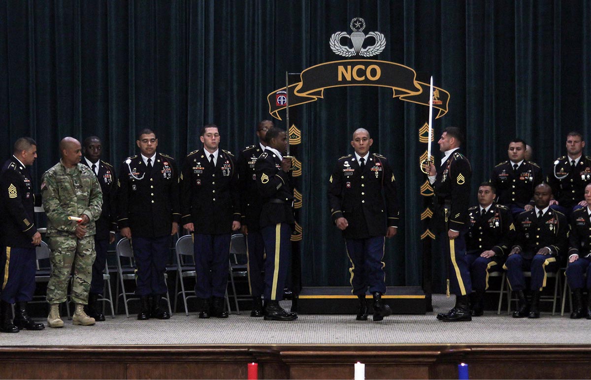 Competitors in the 2015 Drill Sergeant and AIT Platoon Sergeant competition stand at attention after being announced as winners.