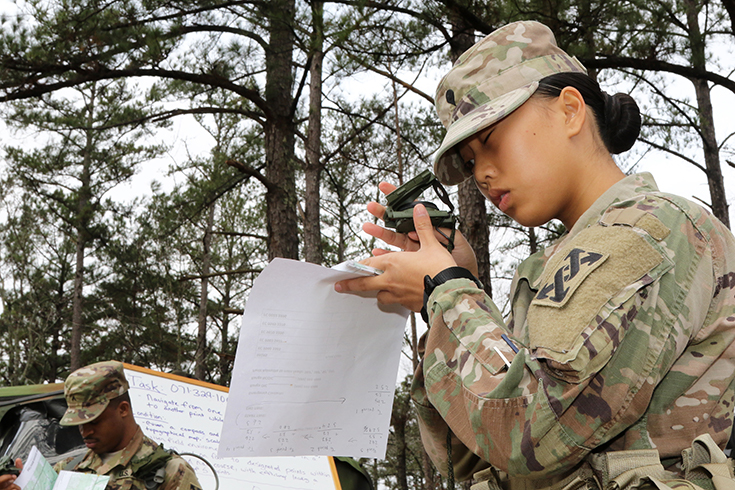 U.S. Army Spc. Anna Tran checks her compass at the 642nd Regional Support Group Best Warrior competition in Fort McClellan, Ala., Jan. 18, 2019